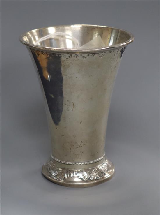 An early 20th century Swedish white metal beaker with flared rim, 11.3cm.